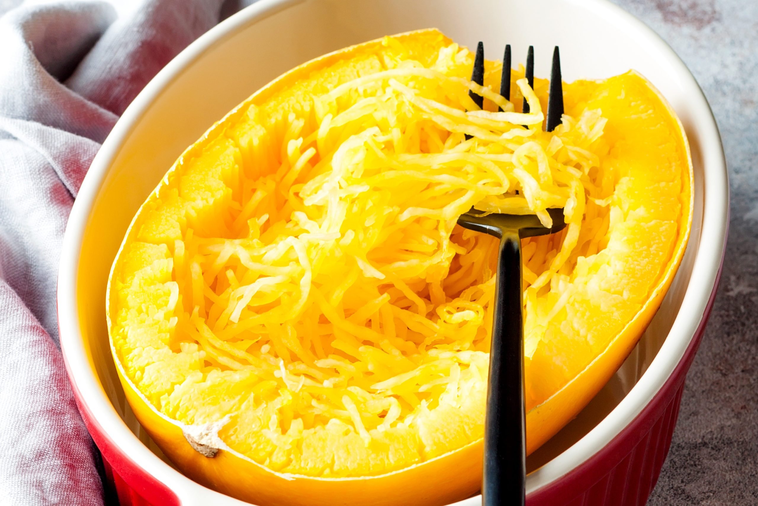 A halved, cooked spaghetti squash