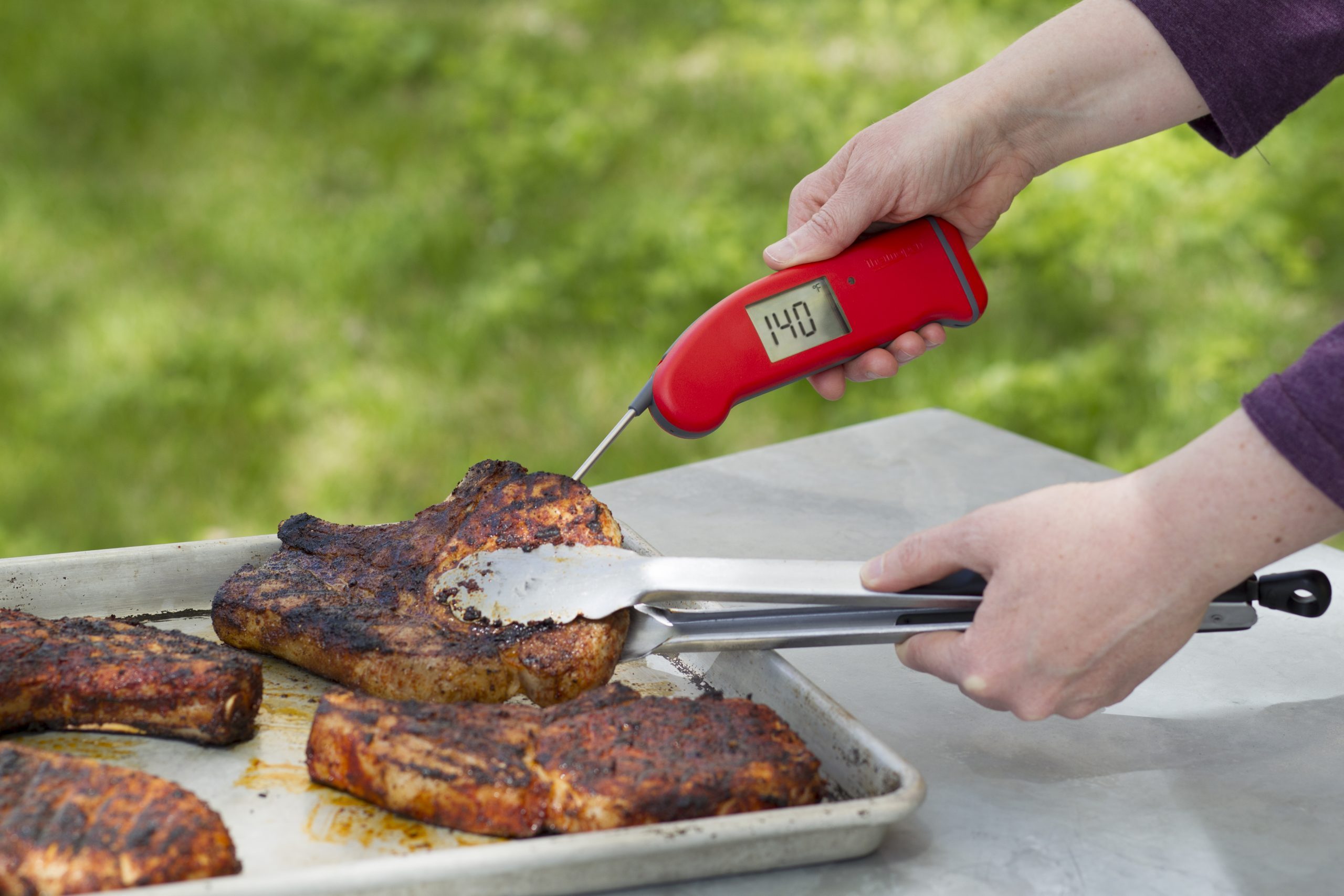 thermometer checking pork chops