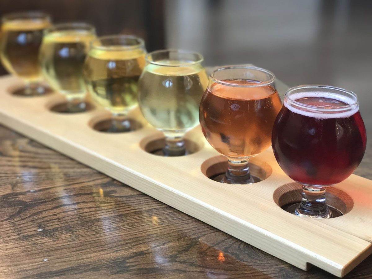 Cider tasting flight on a wood board