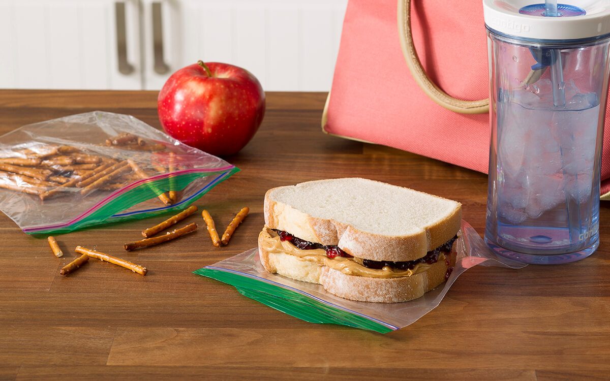 Turn an empty, well-washed milk jug into a reuseable sandwich container.
