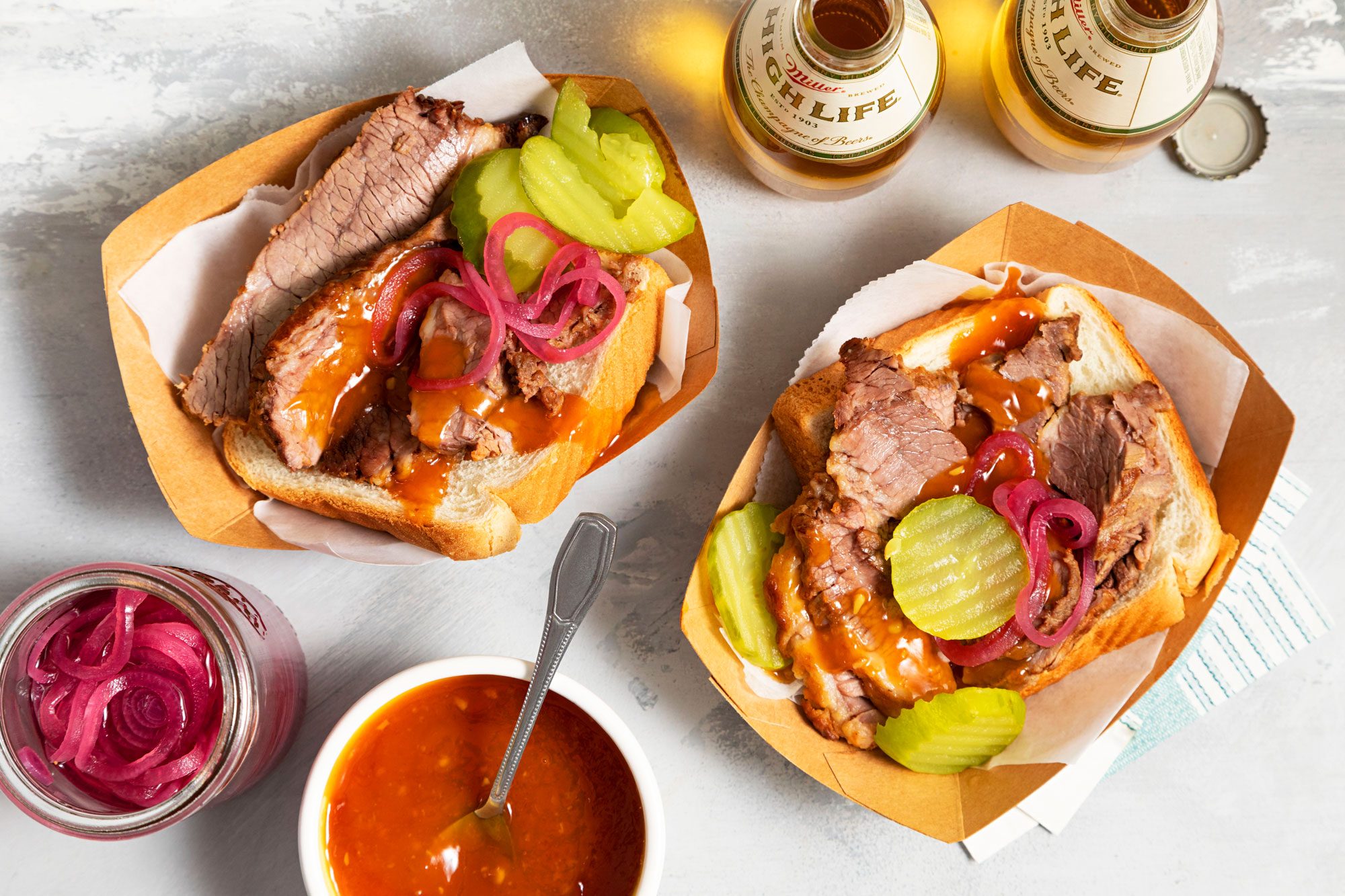 Barbecue brisket sandwich with sauce and pickles