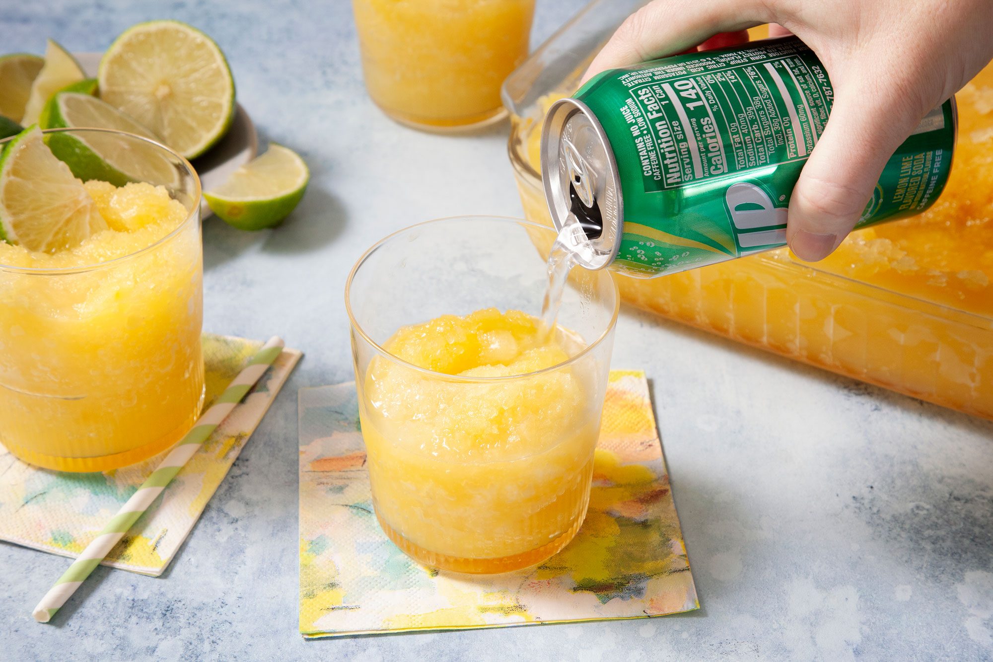 Pouring Lemon-Lime Soda on Brandy Slush in A Rocks Glass