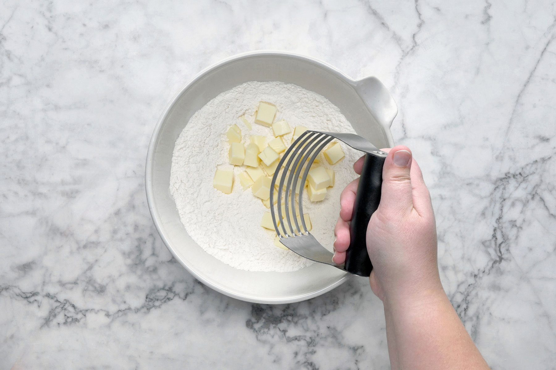 FLour and butter in a large bowl