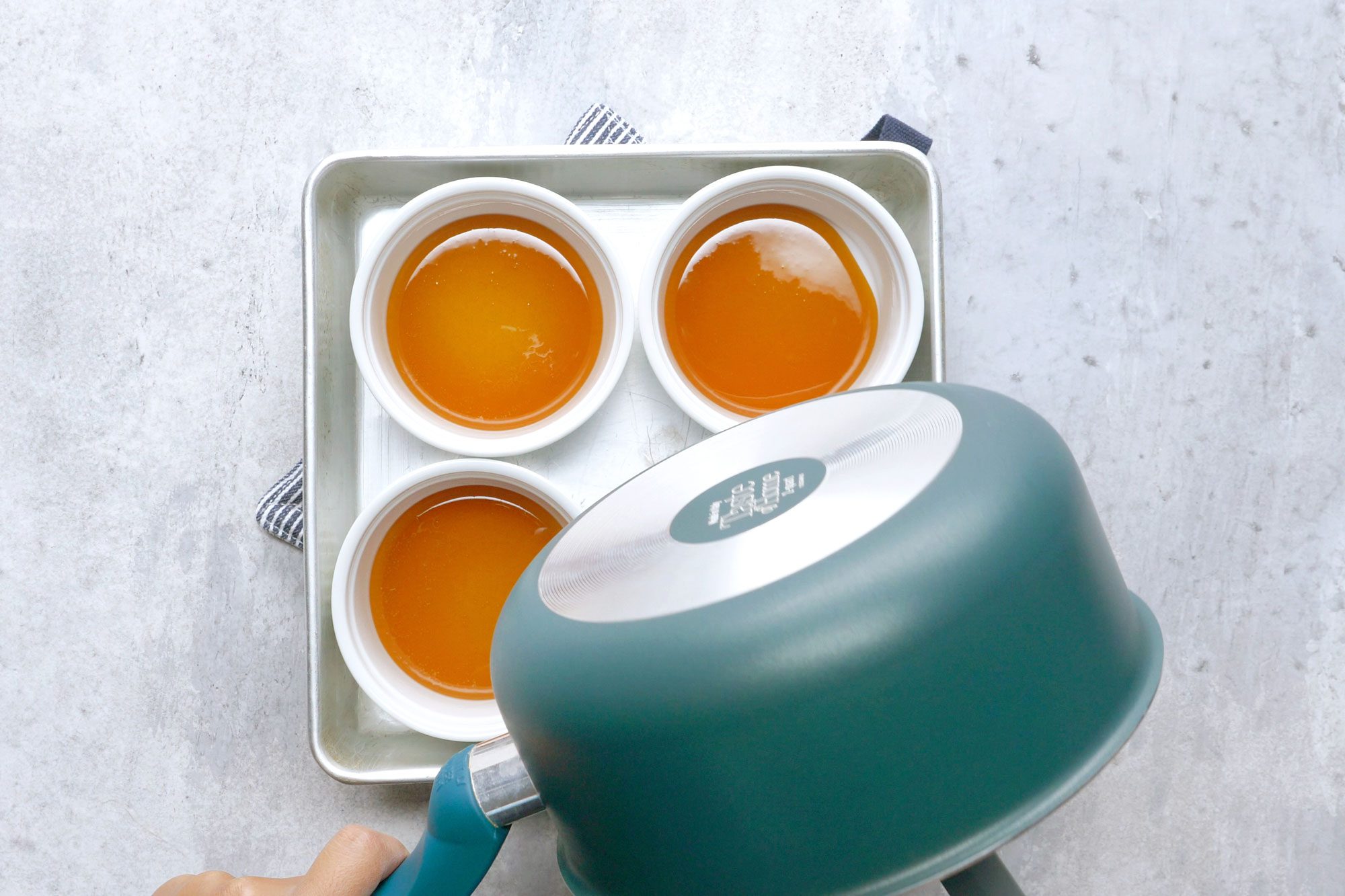 Pour the syrup into eight 6-ounce custard cups