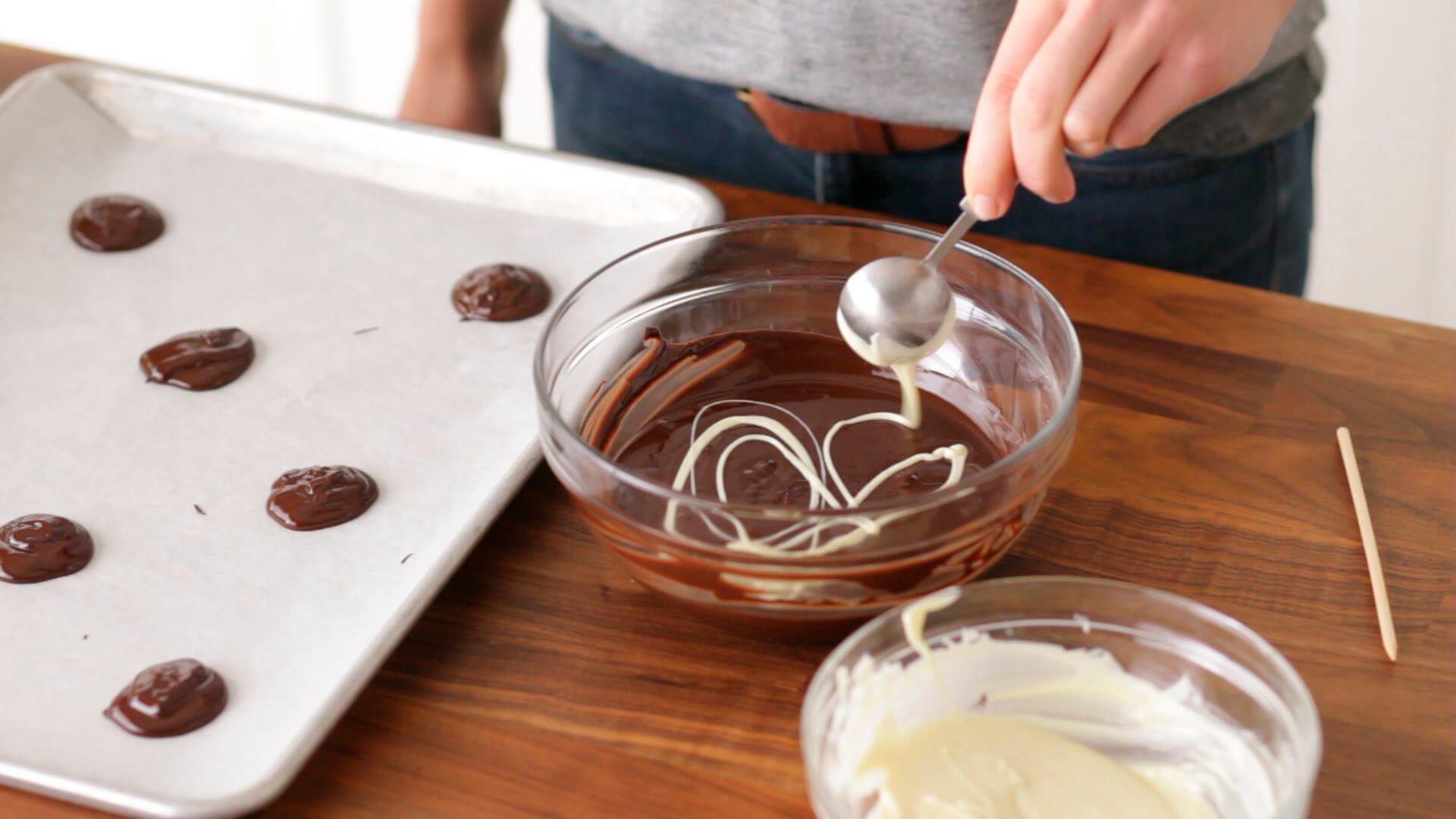 Drizzling white chocolate into bittersweet chocolate