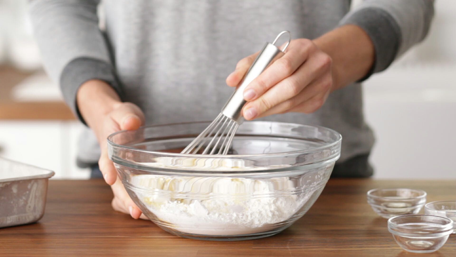 Person whisking ingredients in a bowl