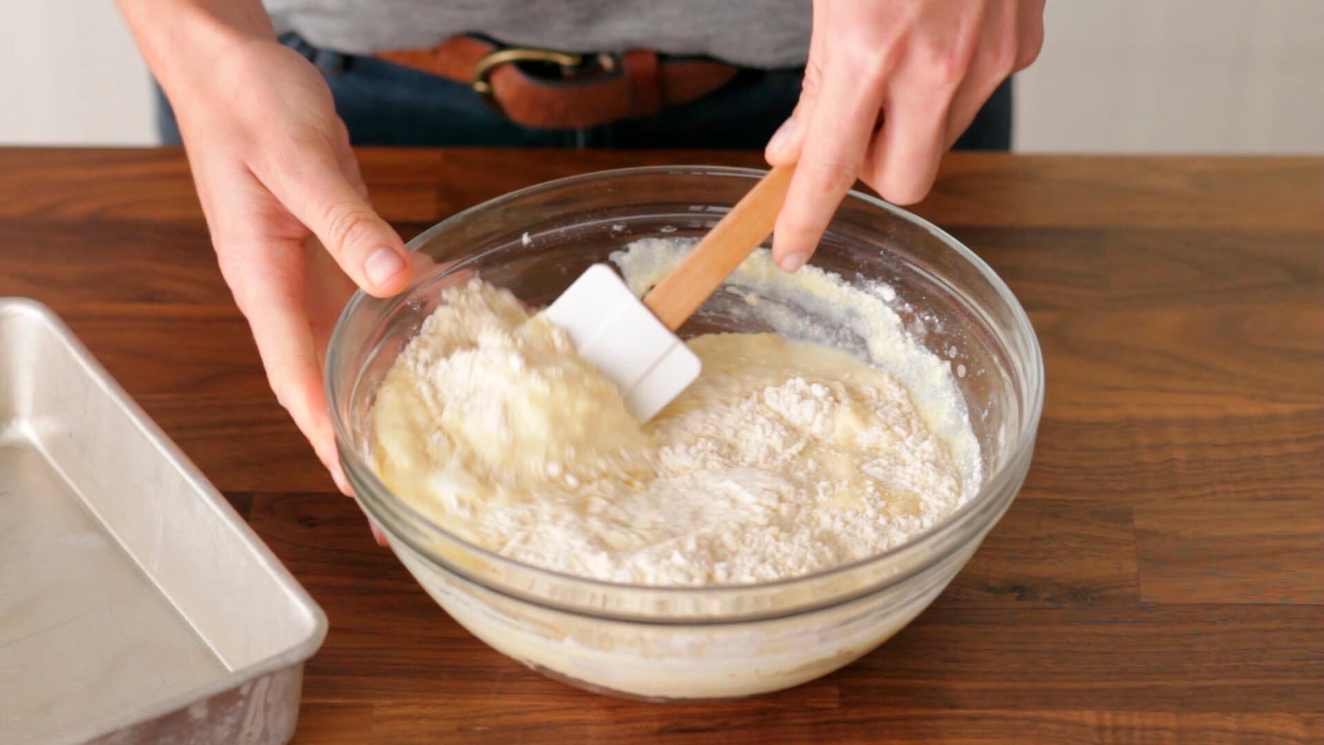 Person mixing ingredients in a bowl