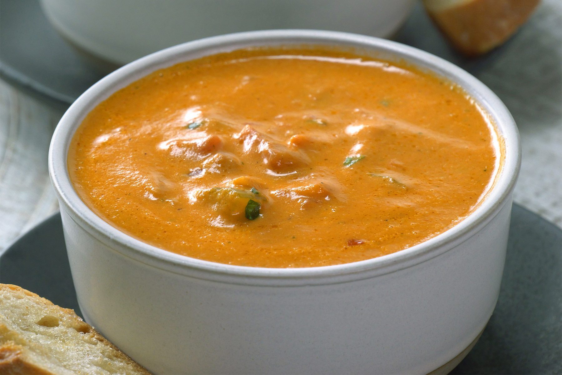 close shot of chunky tomato basil bisque