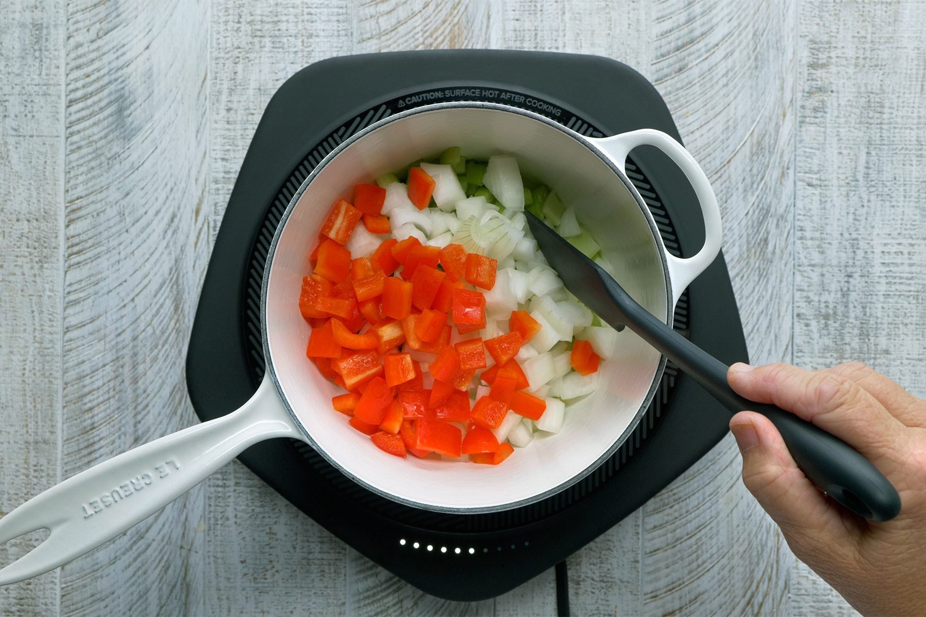 In a large saucepan, saute the celery, onion and red pepper in butter