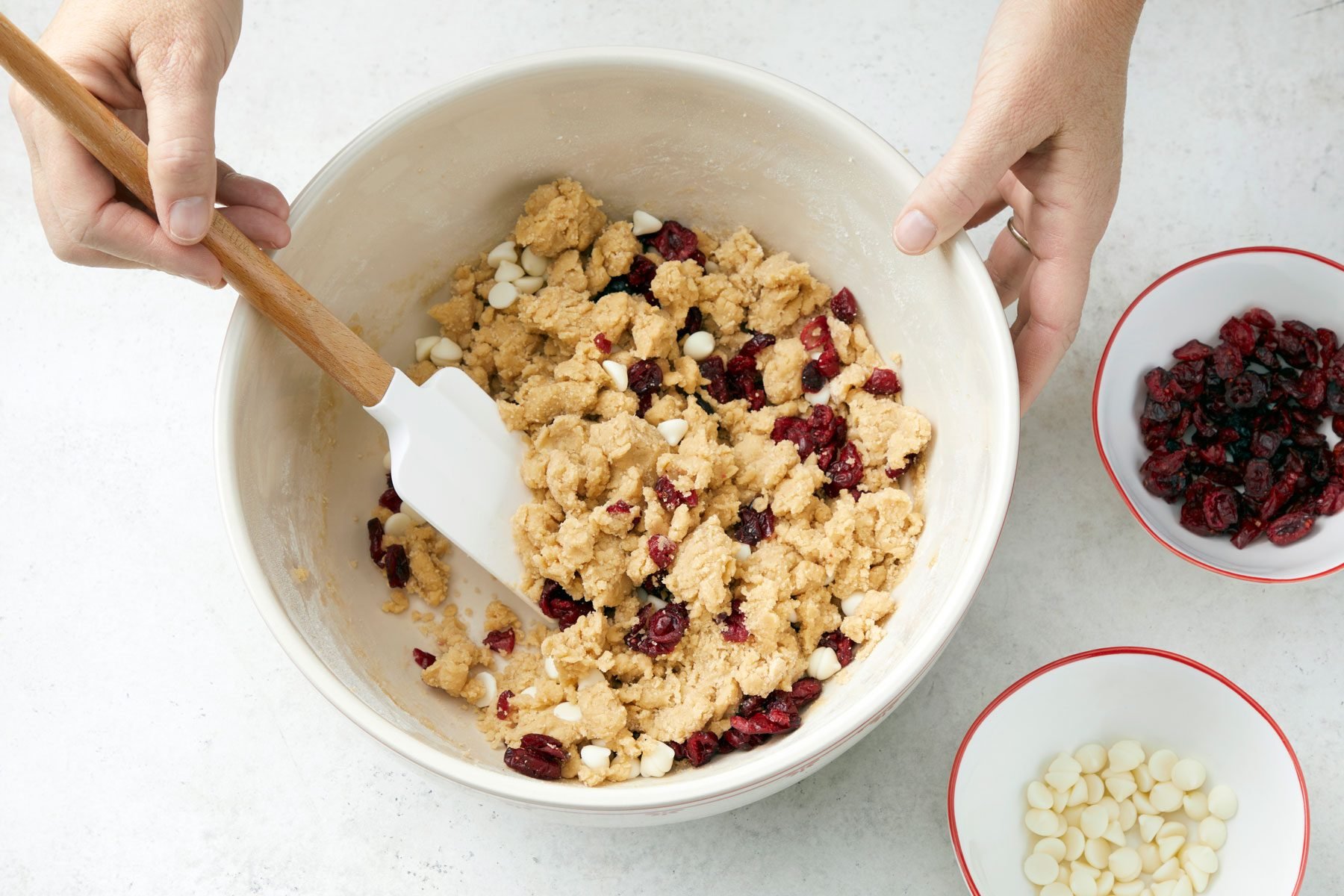 Cranberries and white chocolate chips mixture in a large bowl