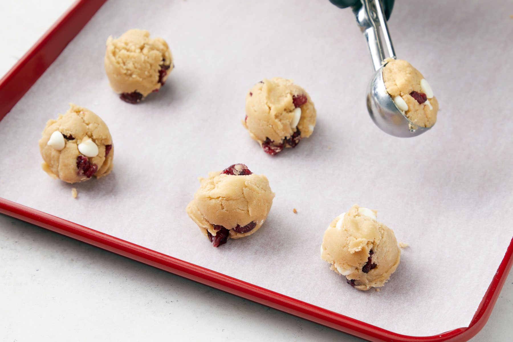Scoops of cookie dough on baking sheets