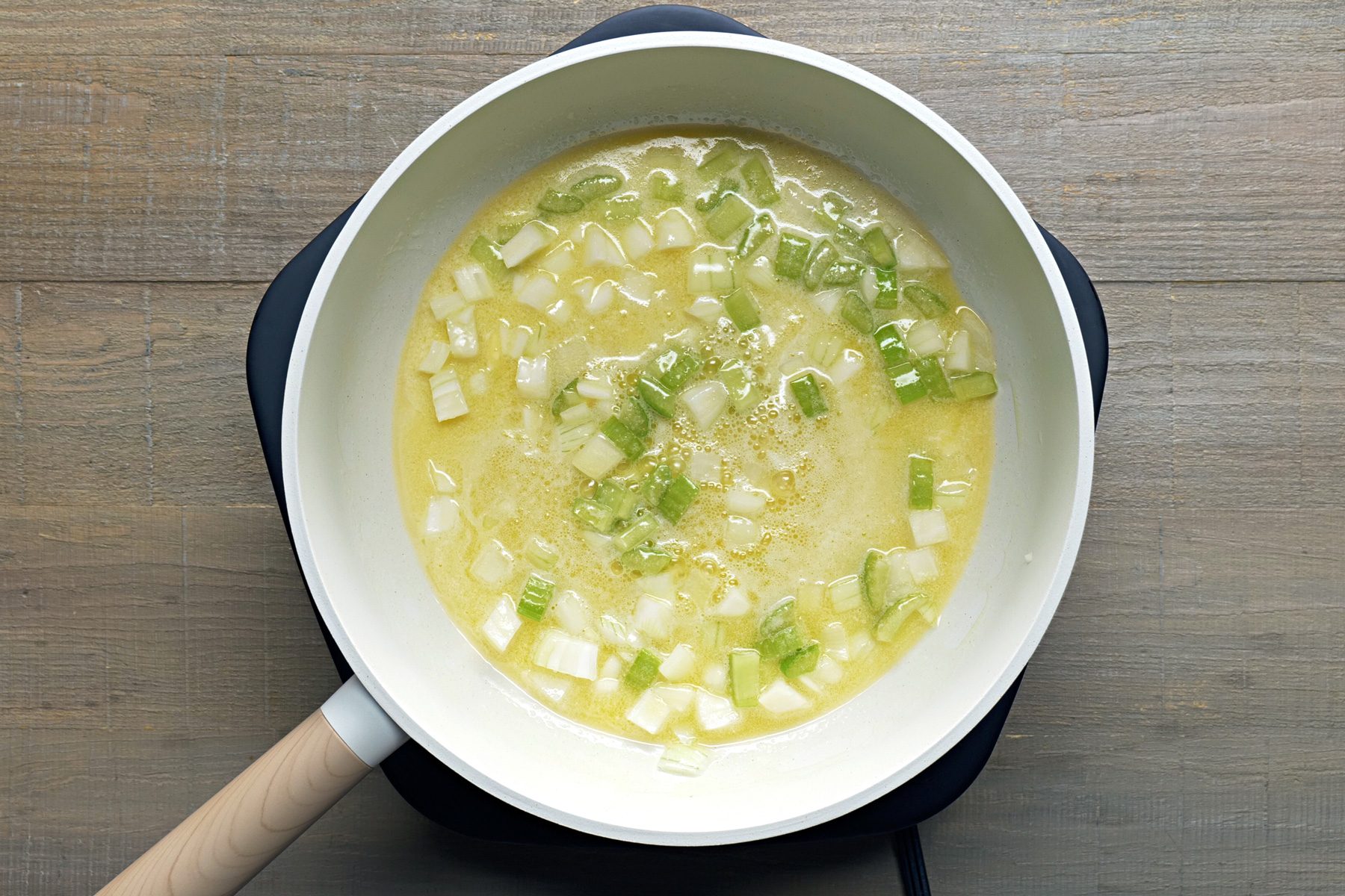 Saute the celery and onion in the butter until tender in a small skillet