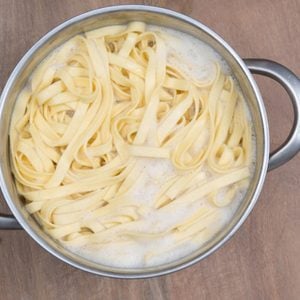 A Food theme: pasta in a boiling water.