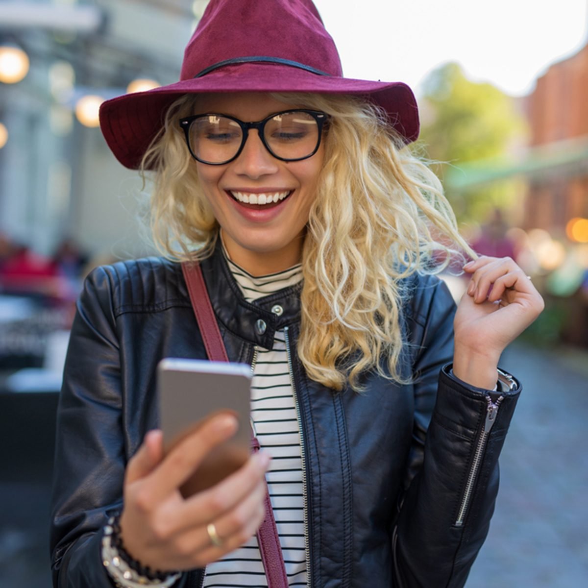 Happy and funny woman looking at her phone; Shutterstock ID 518846440; Job (TFH, TOH, RD, BNB, CWM, CM): Taste of Home