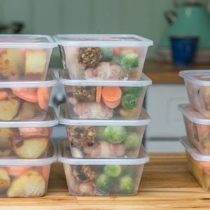 Meal prep. Stack of home cooked roast chicken dinners in containers ready to be frozen for later use as quick and easy ready meals