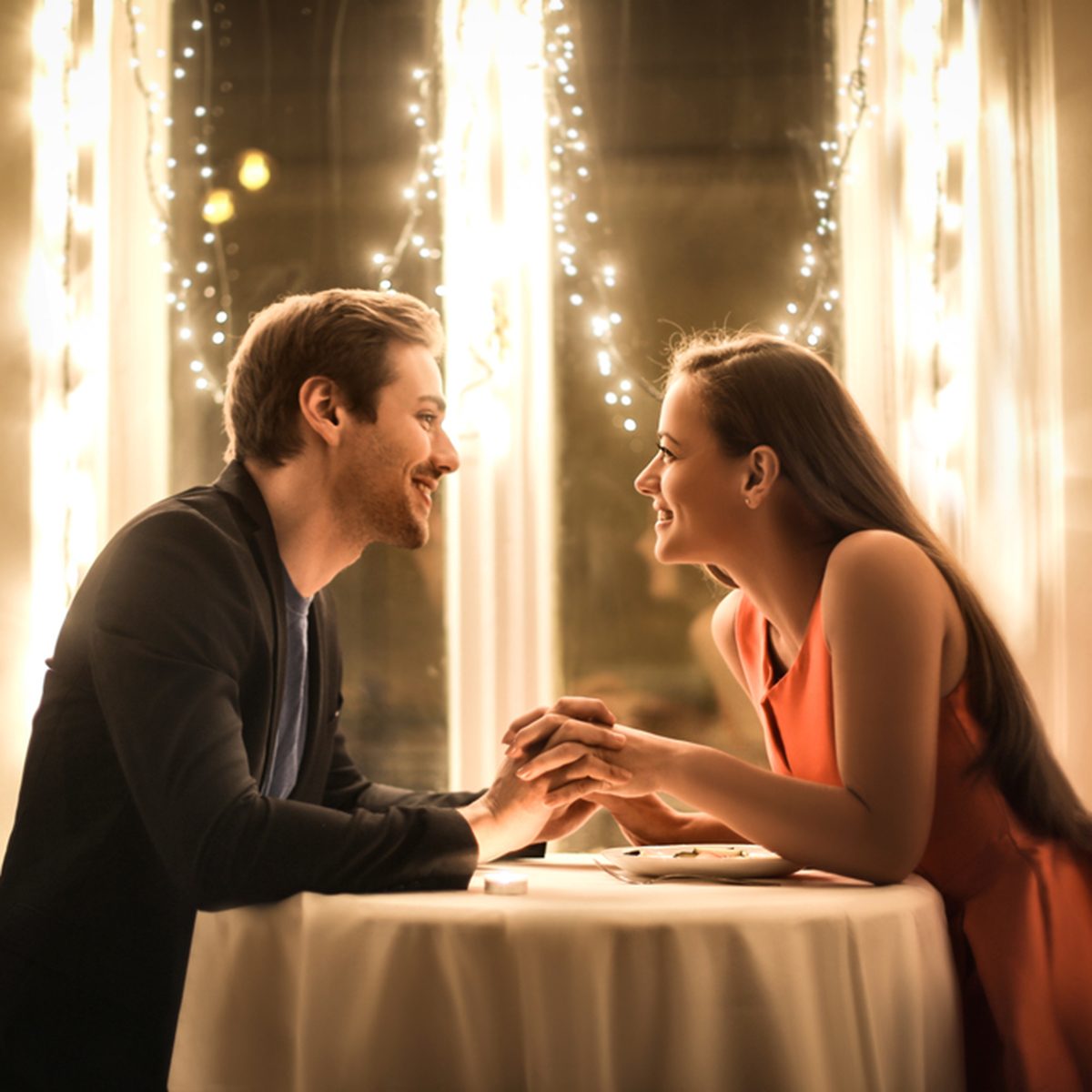 Sweet couple having a romantic dinner; Shutterstock ID 732835063