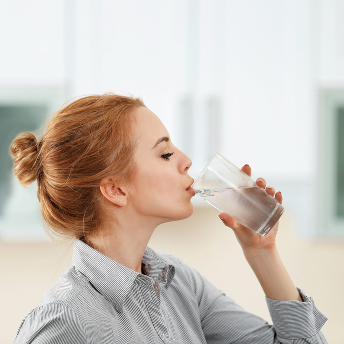 Young woman in the kitchen drinking water; Shutterstock ID 427251640; Job (TFH, TOH, RD, BNB, CWM, CM): TOH