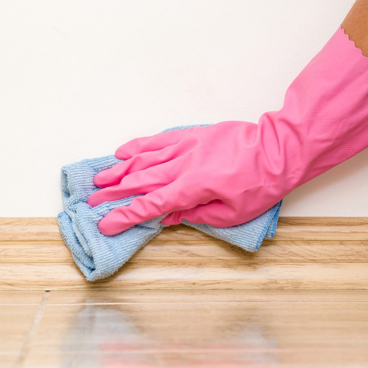 Using a microfiber towel to clean floors instead of the disposable