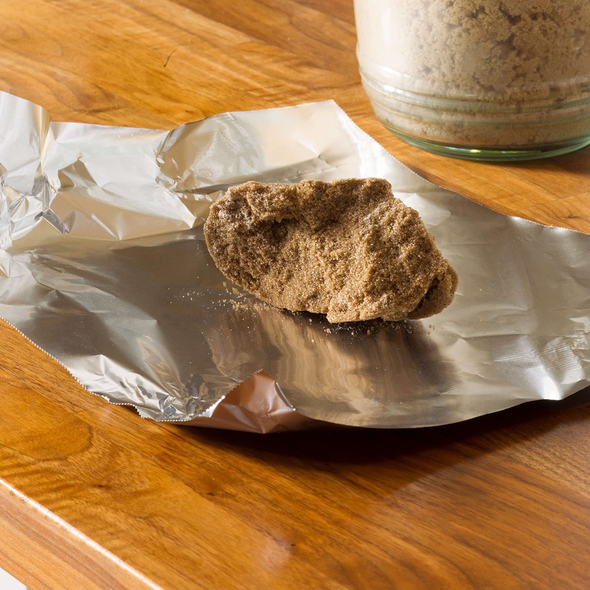 Lump of brown sugar on foil