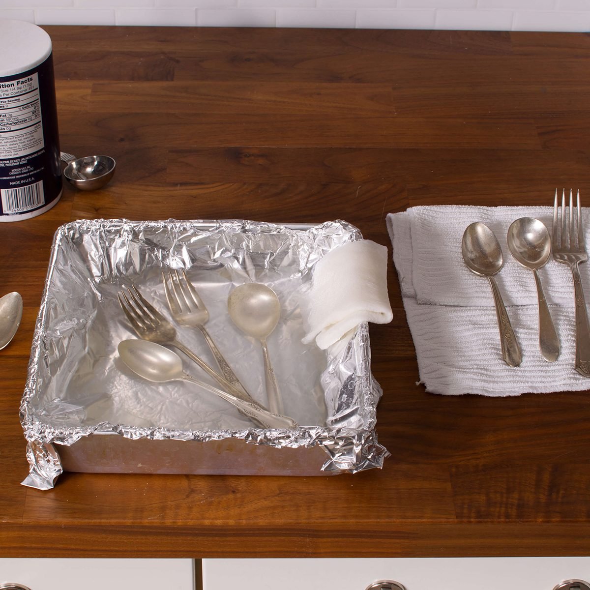 Silverware in a pan lined with foil