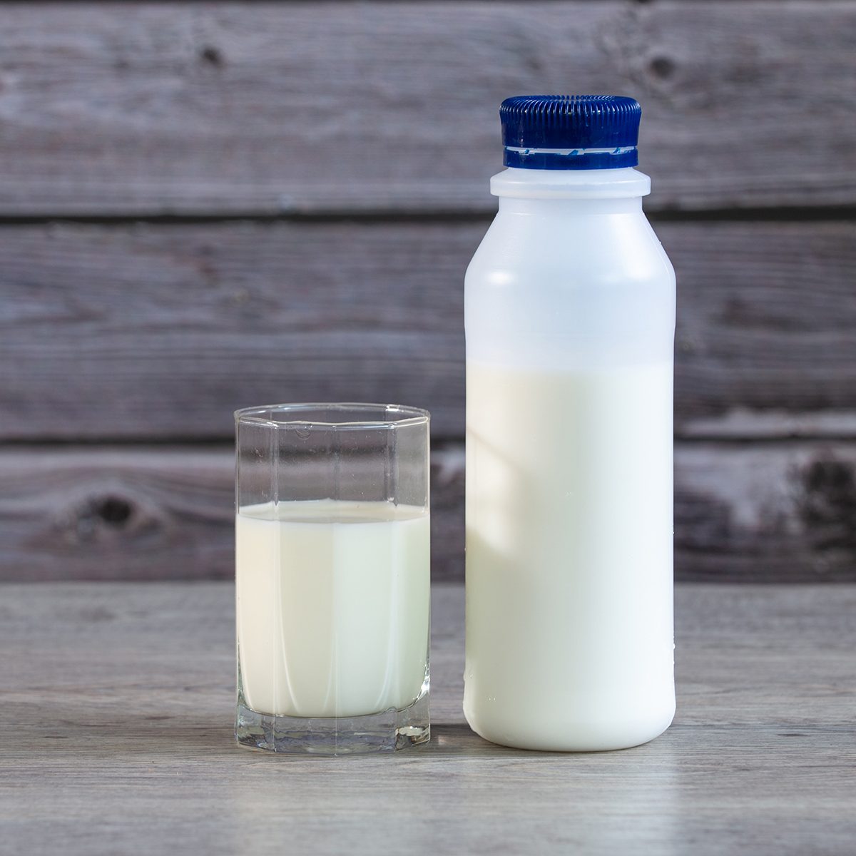 Milk in bottle and Glass of milk on Table