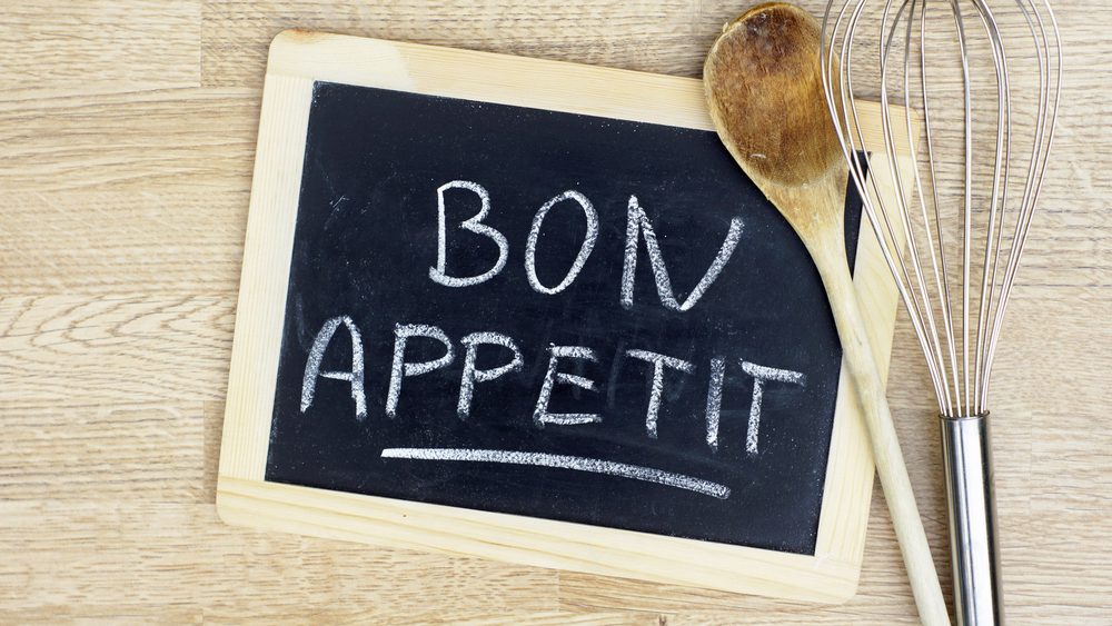 Bon appetit written on chalkboard in the kitchen.