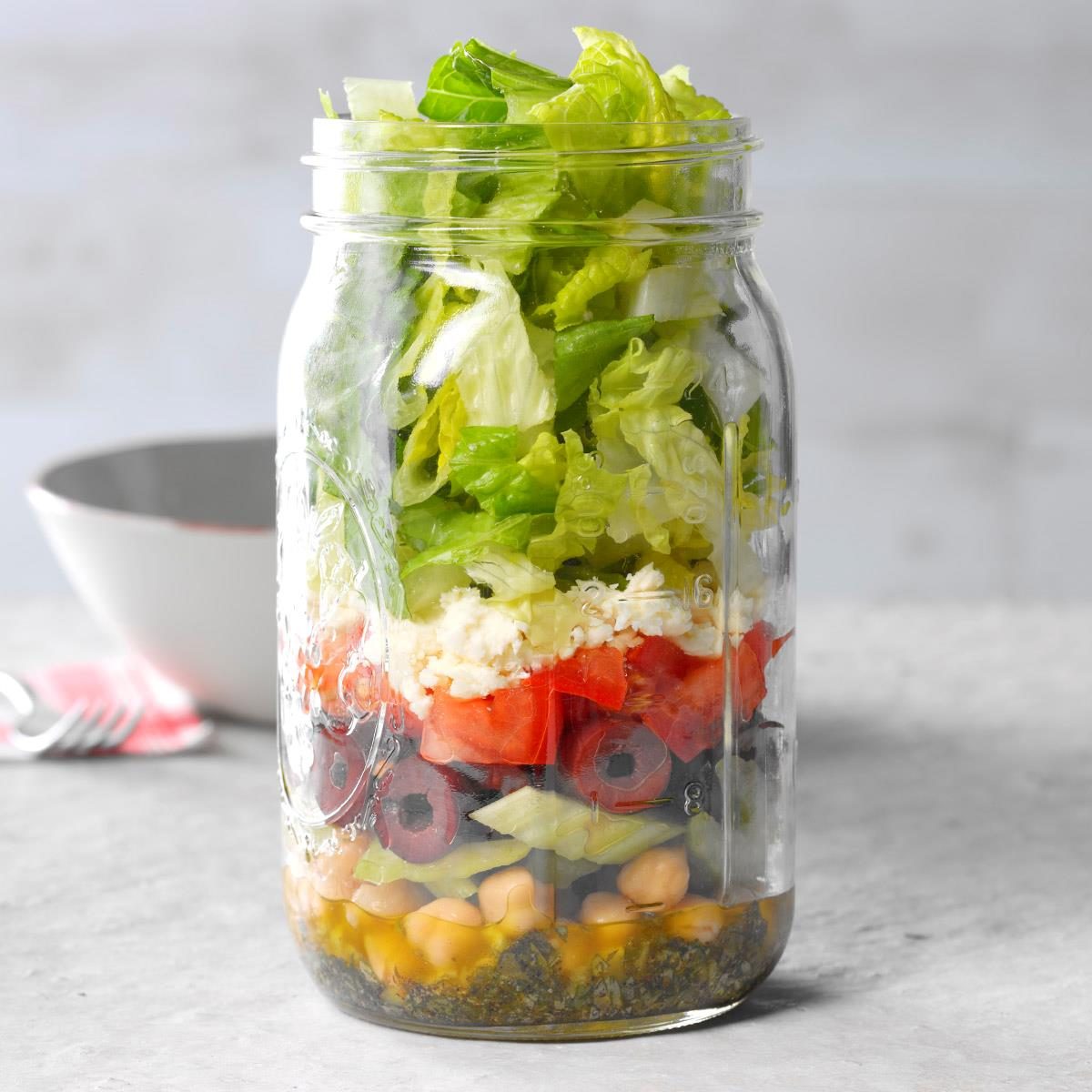 https://www.tasteofhome.com/wp-content/uploads/2018/05/Chopped-Greek-Salad-in-a-Jar_EXPS_MTCBBZ18_224336_D02_28__3b-1.jpg