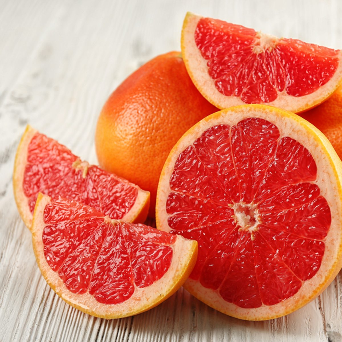 Juicy grapefruits on wooden background; Shutterstock ID 398660866