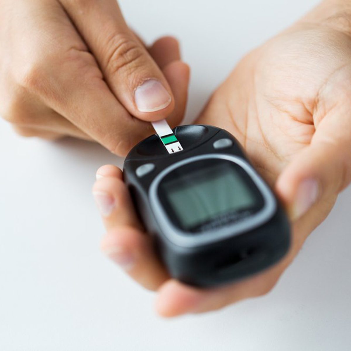 Person checking their blood in a handheld device