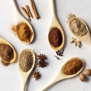 Spoonfuls of allspice, star anise, cinnamon, cloves, nutmeg, cardamom