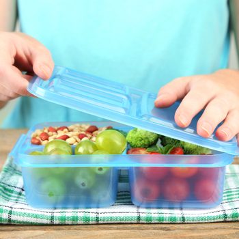 Woman making tasty vegetarian lunch