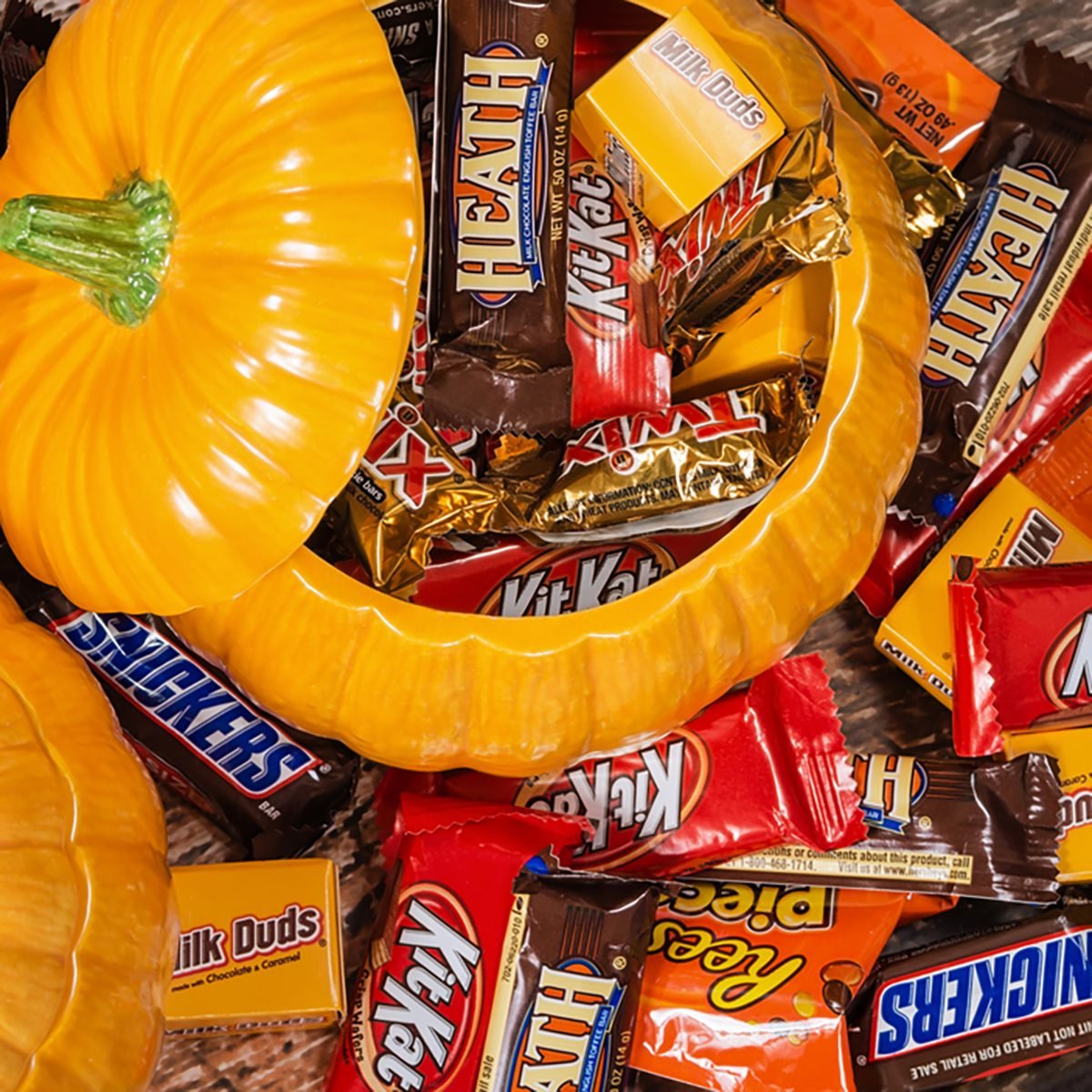 Decorative pumpkins filled with assorted Halloween chocolate candy made by Mars, Incorporated and the Hershey Company.