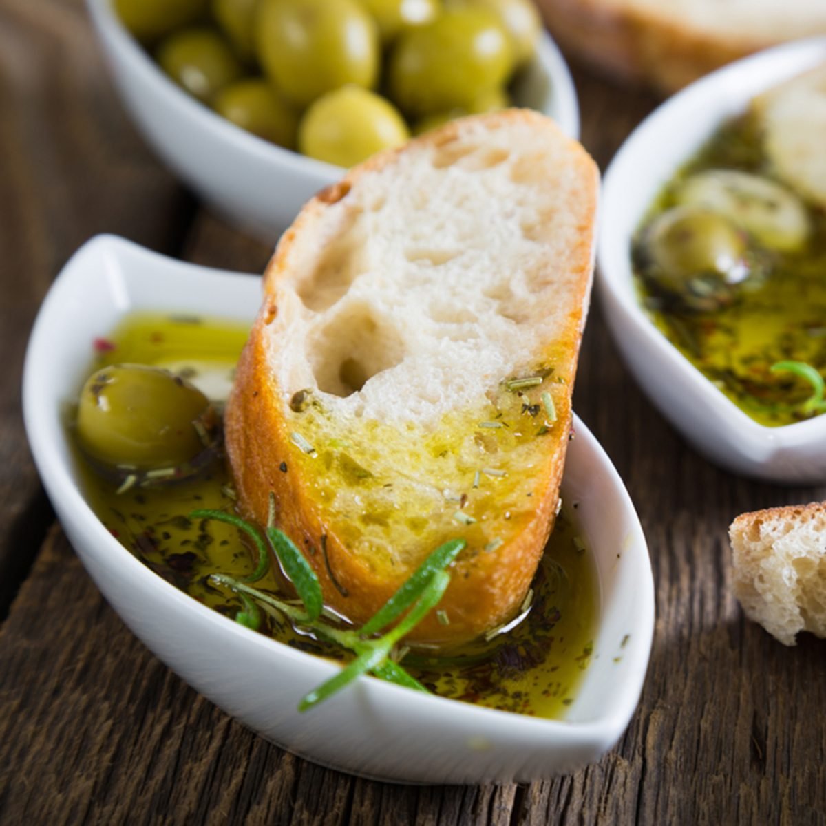The bread dipped in olive oil with herbs and spices
