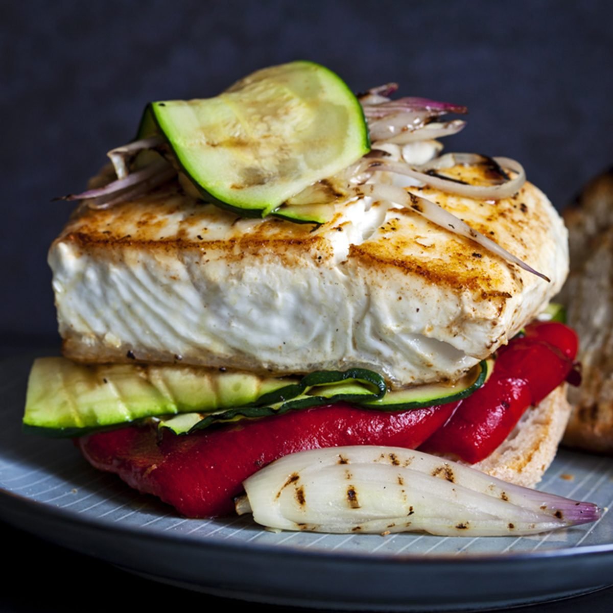 Grilled halibut sandwich with courgettes and red pepper