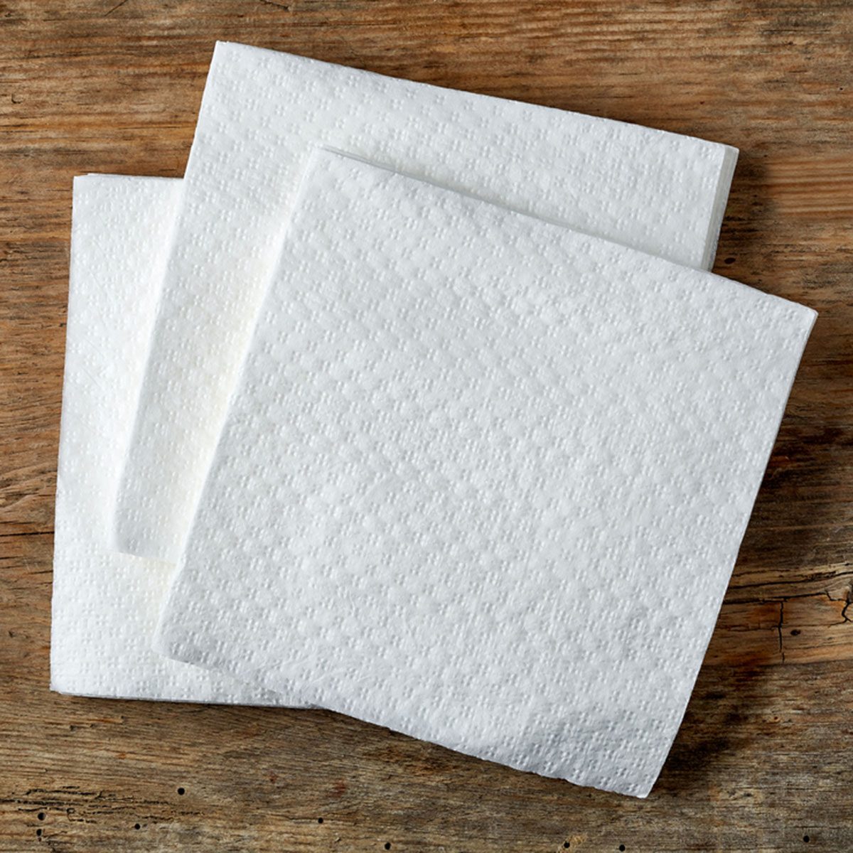 White paper napkin on wooden table, top view; Shutterstock ID 374417176; Job (TFH, TOH, RD, BNB, CWM, CM): Taste Recipes