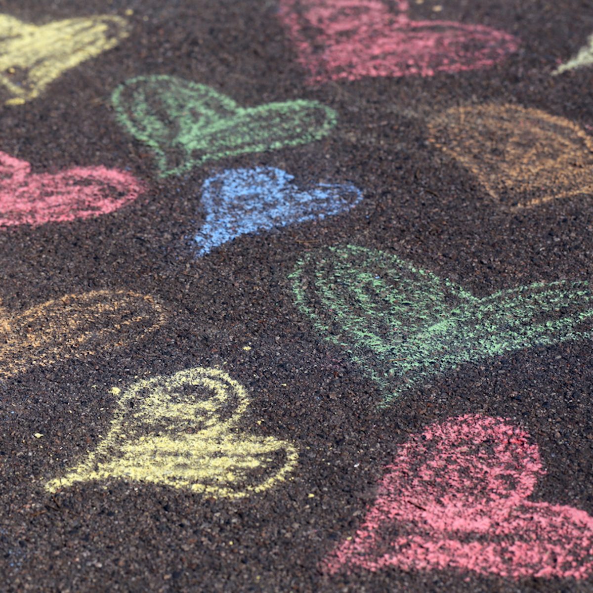 Chalk drawings on asphalt;