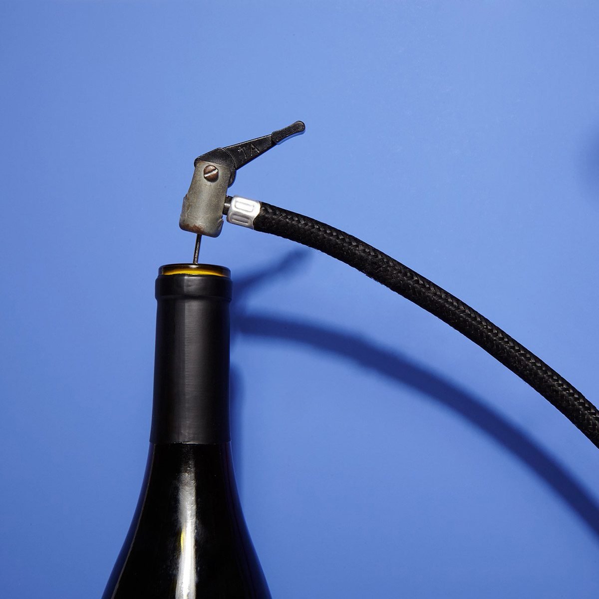 Pumping air into a wine bottle