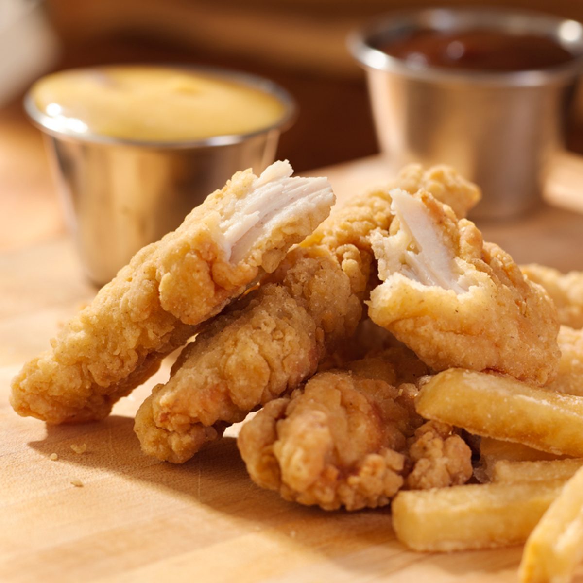 fried chicken strips with french fries and sauce.; Shutterstock ID 110470943; Job (TFH, TOH, RD, BNB, CWM, CM): TOH