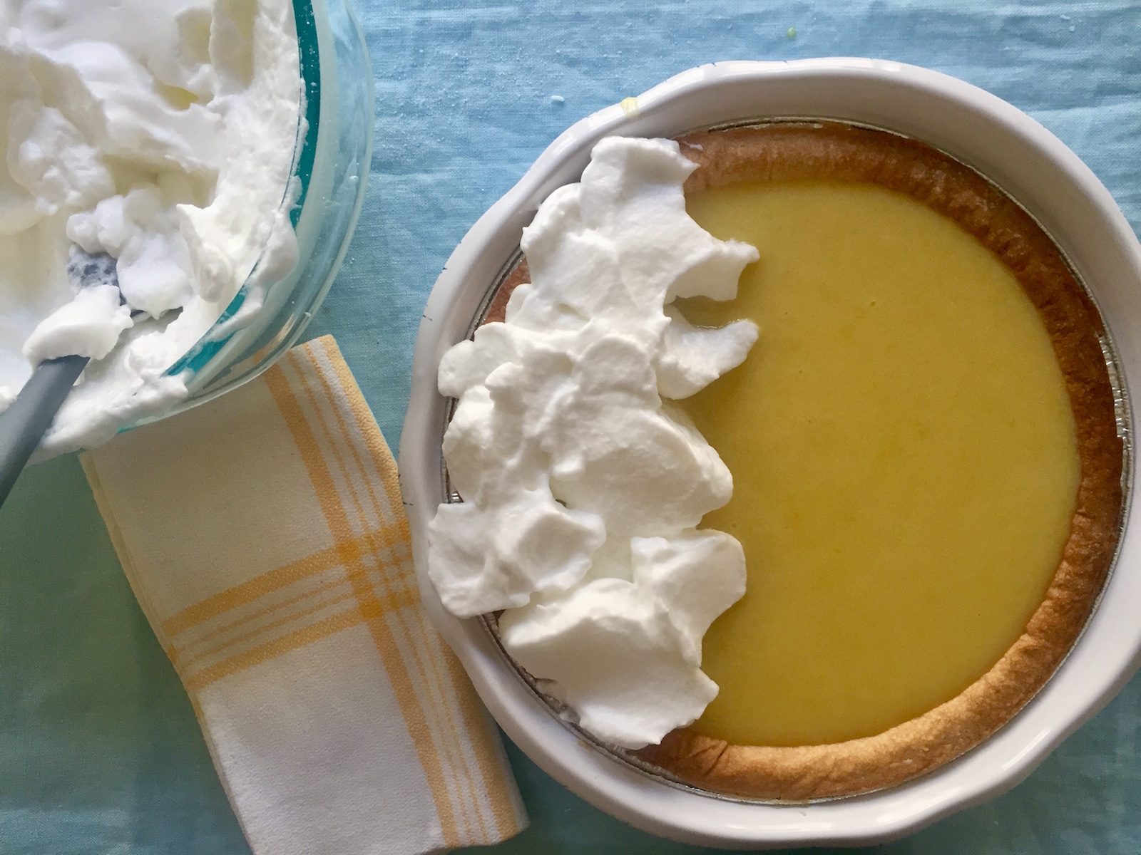 Making Reese Witherspoon's lemon pie, adding meringue to pie