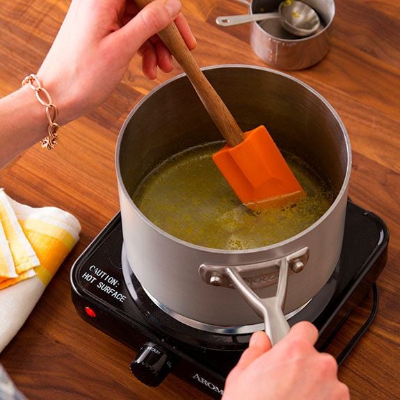 sauce pan heating up with the lemonade inside