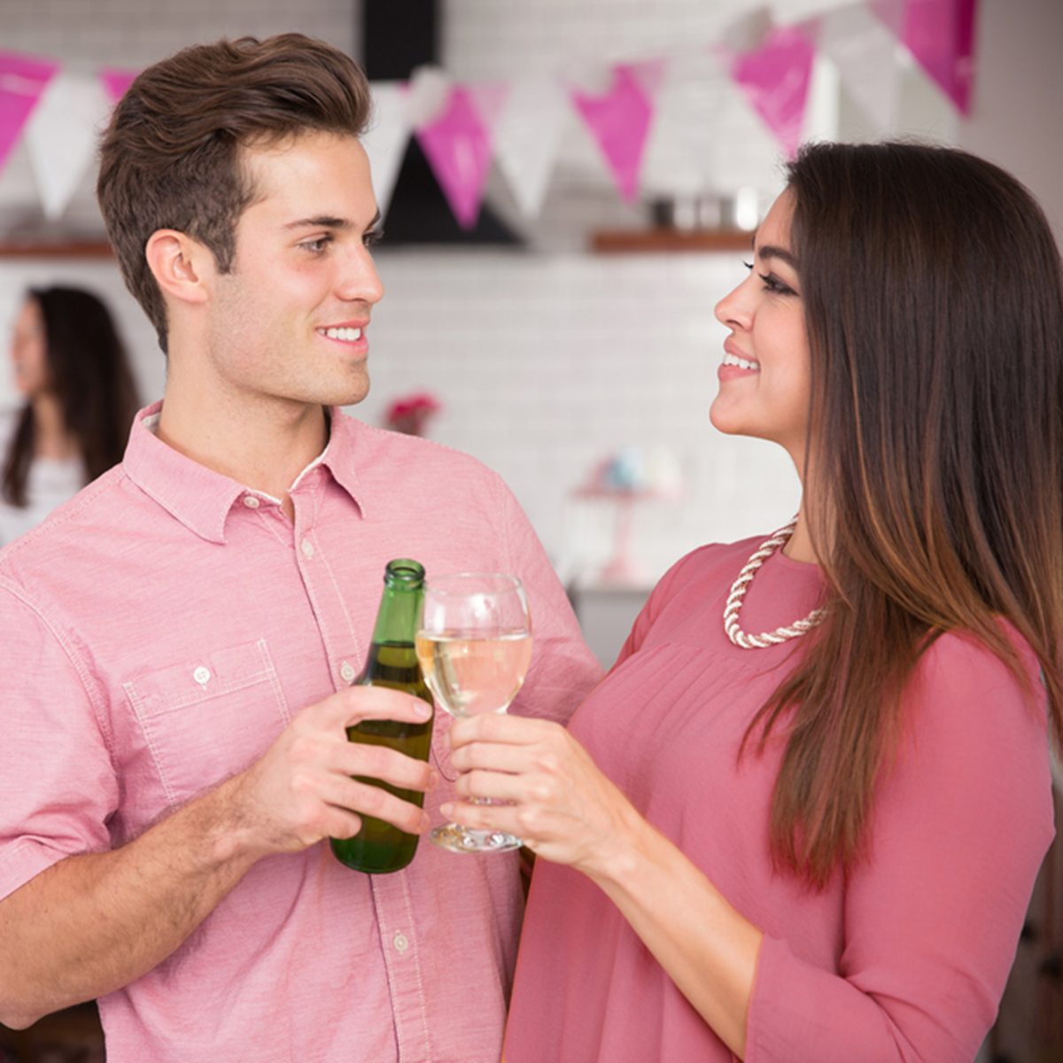 Couple toasting cheers at engagement party celebration engaged happy lovers with friends