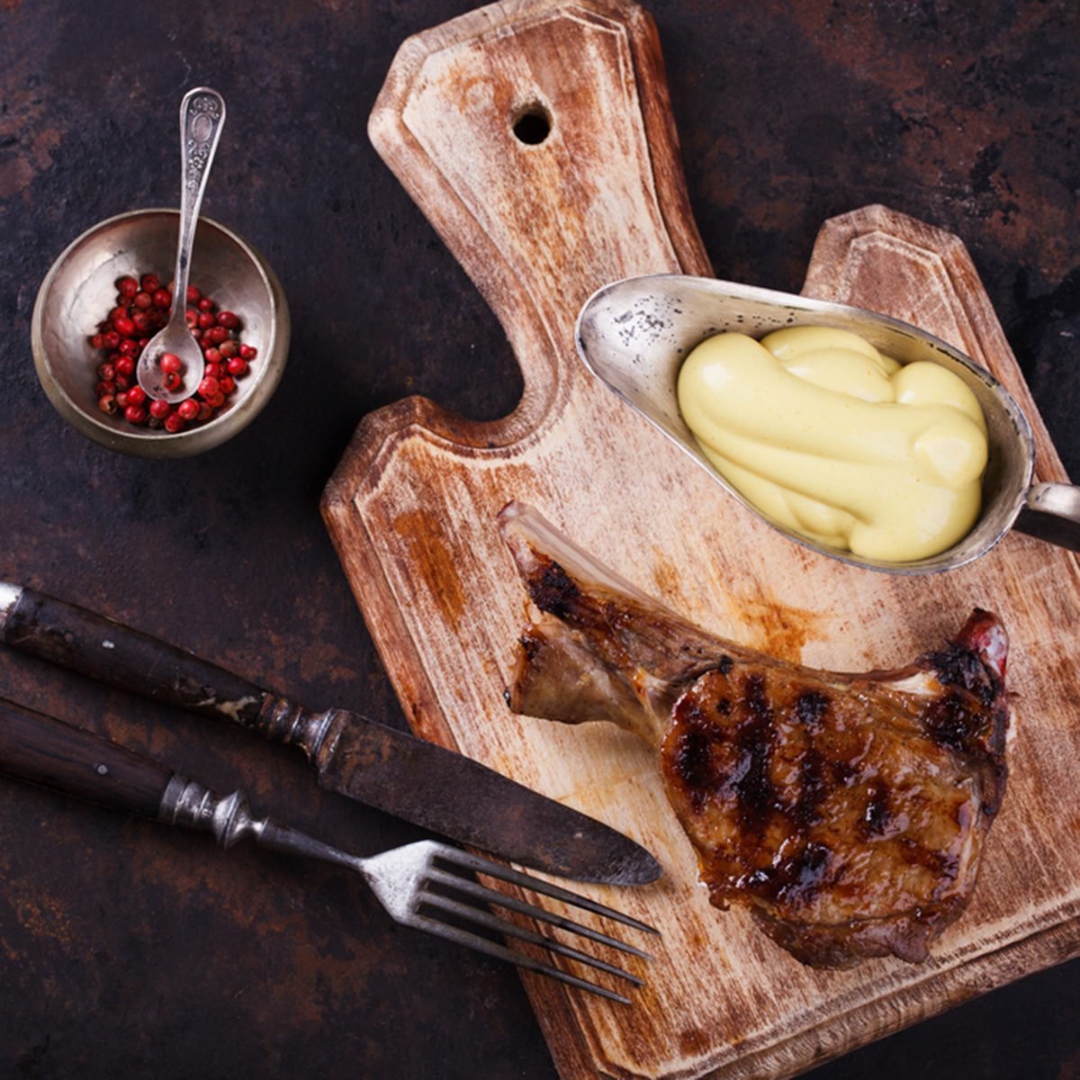 Grilled meat on the bone with mustard sauce.