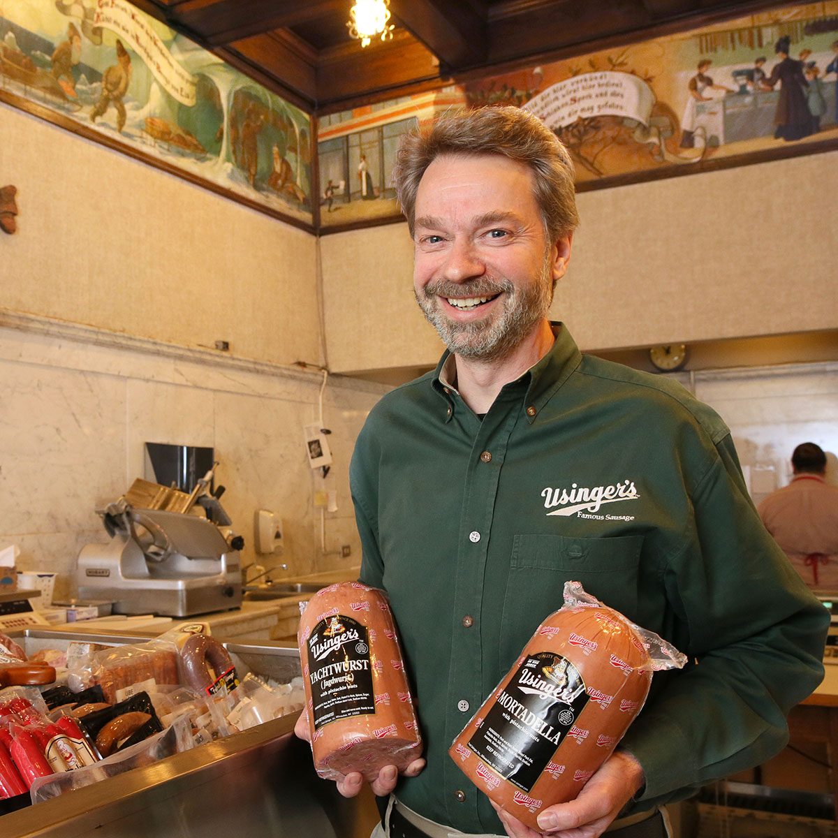 Fred Usinger posing with sausage