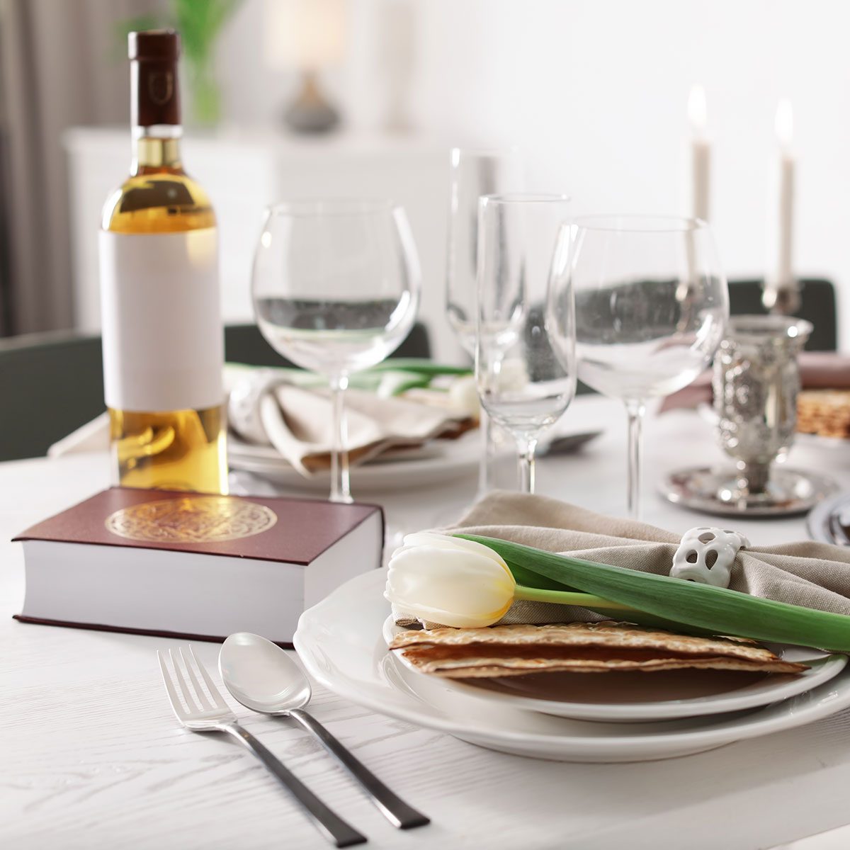 Festive Passover table setting with Torah at home.