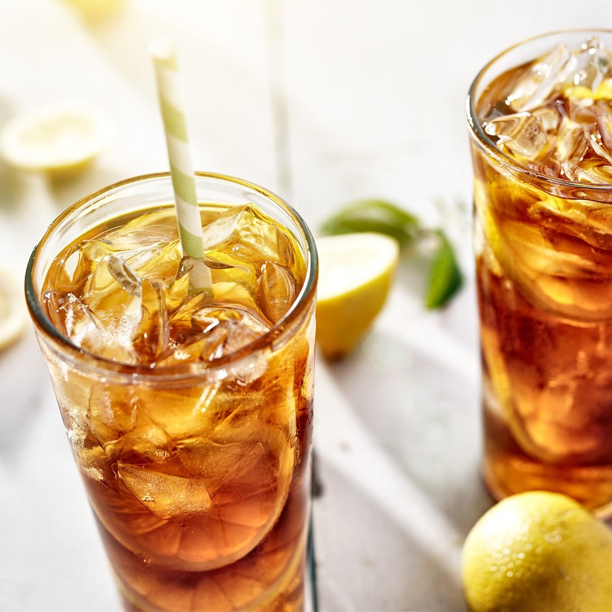 cold iced tea with straws and lemon slices in summer sun.; Shutterstock ID 112400303; Job (TFH, TOH, RD, BNB, CWM, CM): Taste of Home