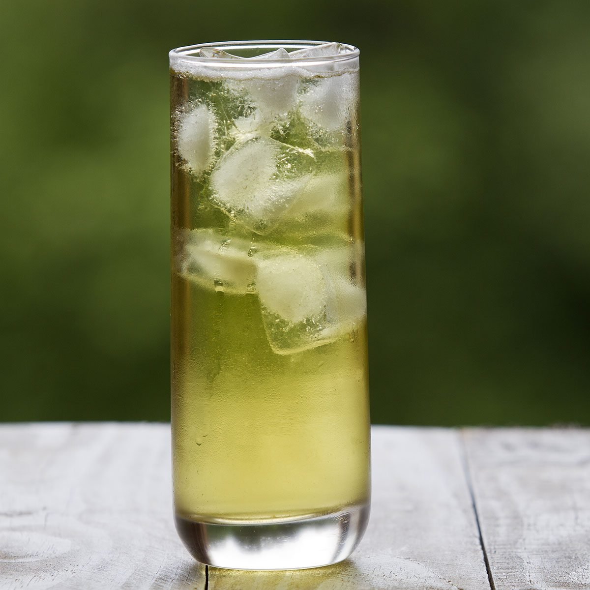 Green in a tall glass with ice on rustic table tea and focus background; Shutterstock ID 281292701; Job (TFH, TOH, RD, BNB, CWM, CM): Taste of Home