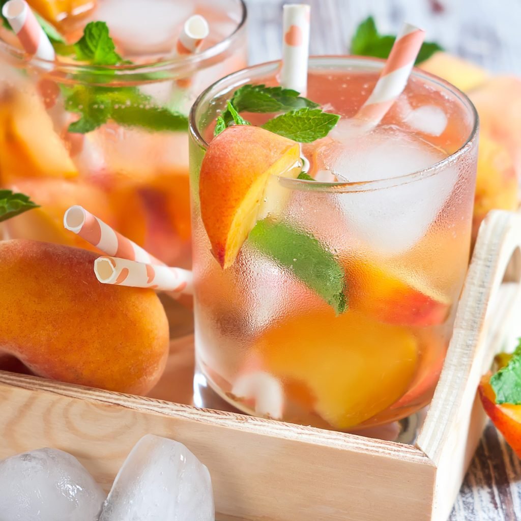 Homemade lemonade with ripe flat saturn-shaped peaches and fresh mint; Shutterstock ID 287555657; Job (TFH, TOH, RD, BNB, CWM, CM): Taste of Home