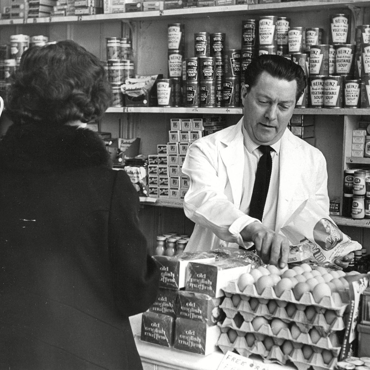 In His Shop Bev Martin Hands Out Groceries. In The Evening Martin Serves Pub Customers With Non-canned Music. Pub Entertainers Feature. Box 673 422031646 A.jpg. In His Shop Bev Martin Hands Out Groceries. In The Evening Martin Serves Pub Customers With Non-canned Music. Pub Entertainers Feature.