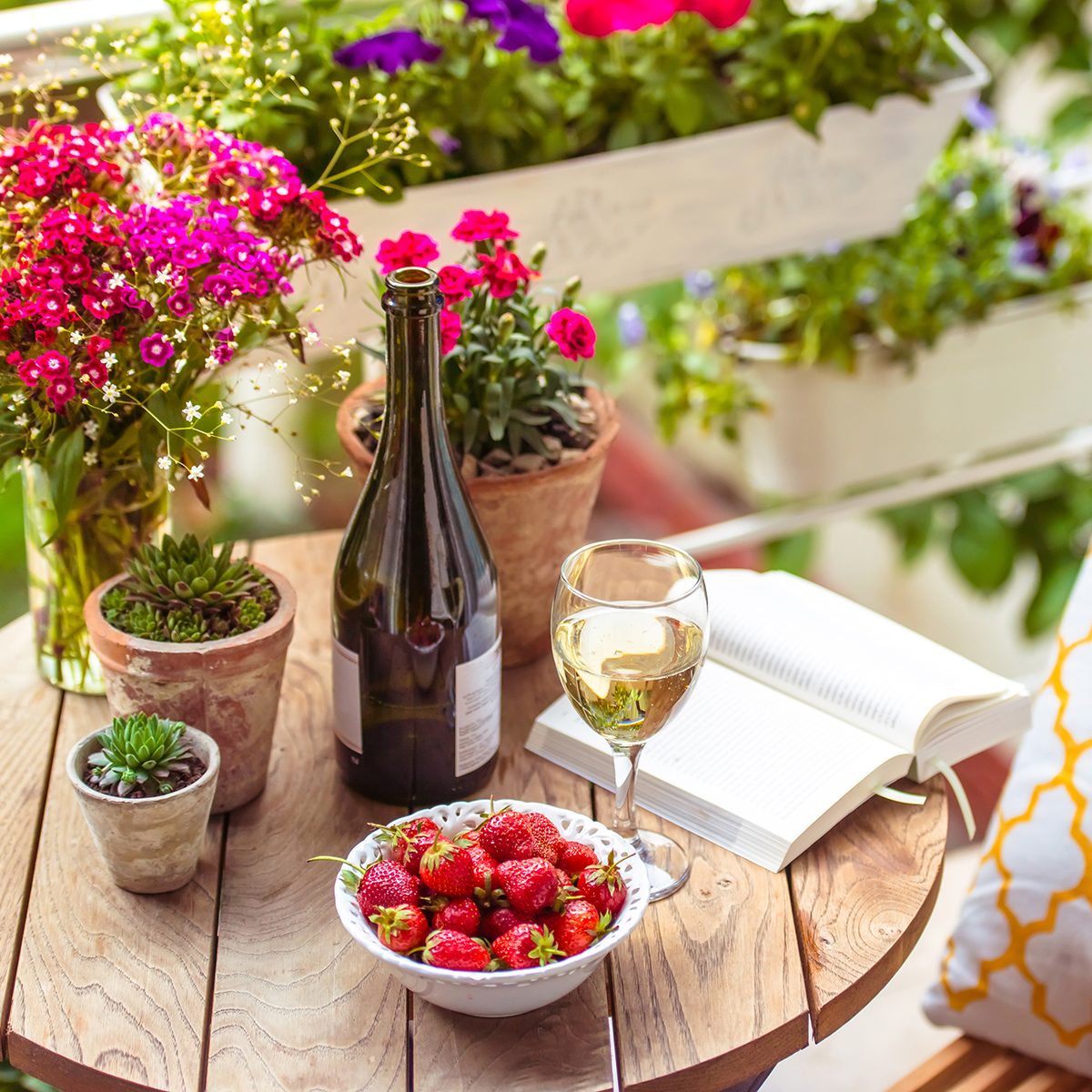 Beautiful terrace or balcony with small table, chair and flowers