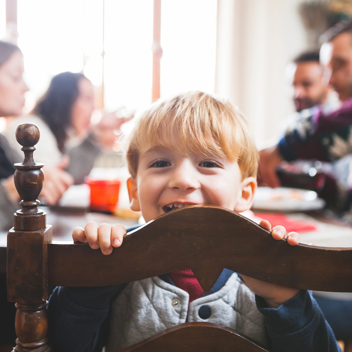 Cute Playful Preschooler Child at Christmas Dinner;